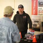 Alex Douthit, of Kenai Peninsula Driving Instruction, speaks to attendees of the Kenai Peninsula Job and Career Fair in Kenai, Alaska, on Wednesday, April 16, 2025. (Jake Dye/Peninsula Clarion)