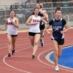 Soldotnas Annie Burns leads Kenai Centrals Ruby Davis and Mya Taylor in the 800-meter run at the Soldotna Mini Meet on Tuesday, April 15, 2025, at Soldotna High School in Soldotna, Alaska. (Photo by Jeff Helminiak/Peninsula Clarion)