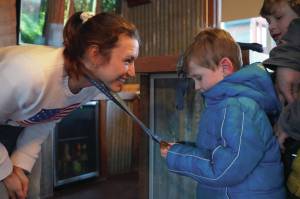 Kristen Faulkner, who won two gold medals for cycling at the Paris 2024 Olympics, speaks to Andrew Elam during a meet and greet hosted by the Kenai and Soldotna Chambers of Commerce at the Cannery Lodge in Kenai, Alaska, on Saturday, Dec. 28, 2024. (Jake Dye/Peninsula Clarion)