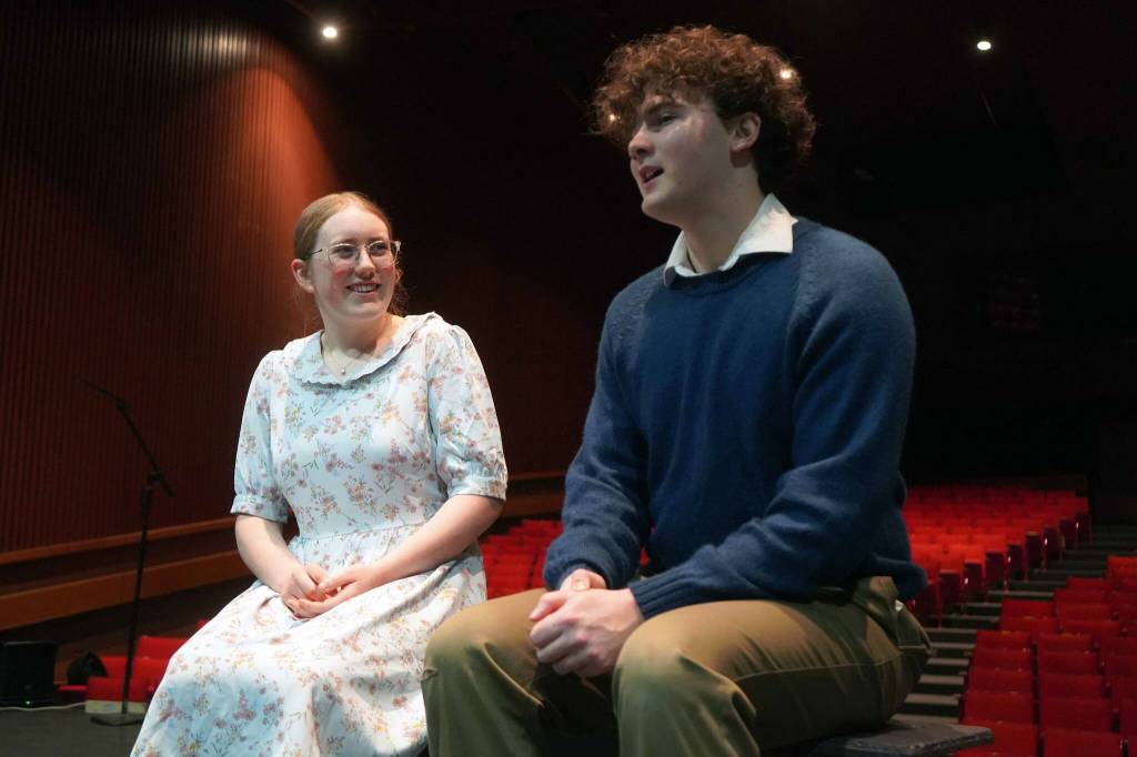 Emerson Kapp and Elias Bouschor rehearse Our Town in the Soldotna High School Auditorium in Soldotna, Alaska, on Friday, April 18, 2025. (Jake Dye/Peninsula Clarion)