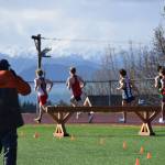 A Kenai Kardinal leads the pack during the steeplechase on Friday, April 18 at the Homer High School Invitational Track Meet. (Chloe Pleznac/Homer News)