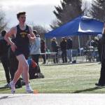 A Homer boy runs the track on Friday, April 18 at the Homer High School Invitational Track Meet. (Chloe Pleznac/Homer News)