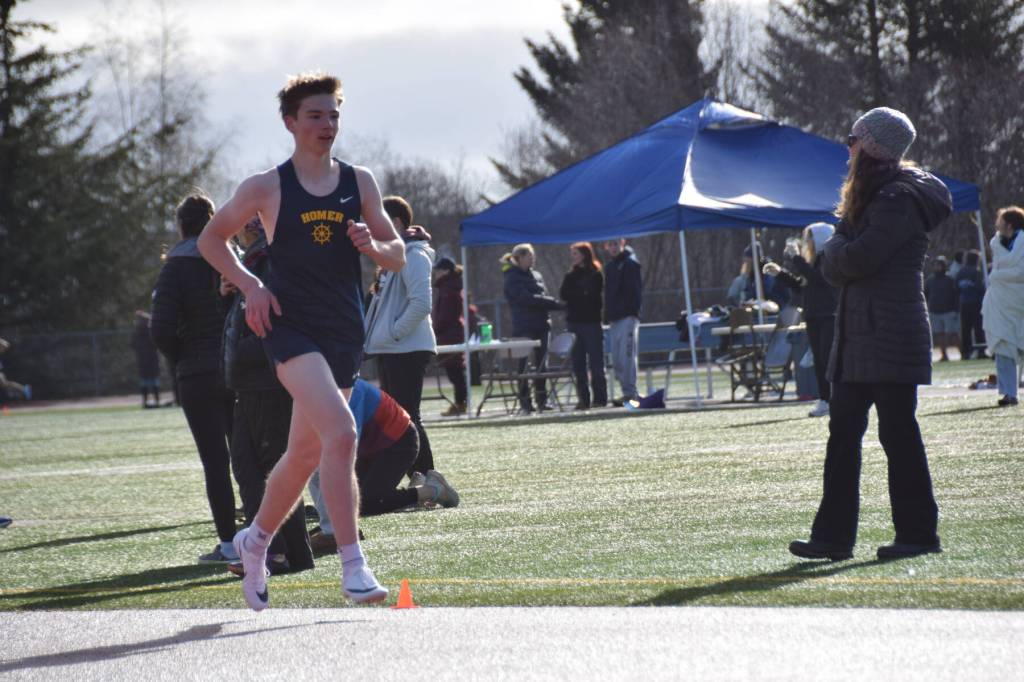 A Homer boy runs the track on Friday, April 18 at the Homer High School Invitational Track Meet. (Chloe Pleznac/Homer News)