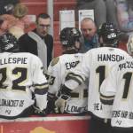 Kenai River Brown Bears head coach Taylor Shaw and assistant Dean Weasler talk to the team on Friday, April 4, 2025, at the Soldotna Regional Sports Complex in Soldotna, Alaska. (Photo by Jeff Helminiak/Peninsula Clarion)