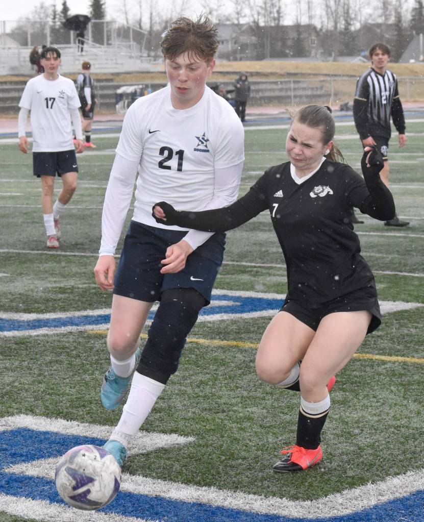 Soldotnas Liam Peck and Nikiskis Jaden Anderson battle for the ball Tuesday, April 22, 2025, at Justin Maile Field at Soldotna High School in Soldotna, Alaska. (Photo by Jeff Helminiak/Peninsula Clarion)