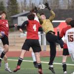 Ketchikan goalie Nathan Iverson collects a corner kick in traffic Wednesday, April 23, 2025, at Ed Hollier Field at Kenai Central High School in Kenai, Alaska. (Photo by Jeff Helminiak/Peninsula Clarion)