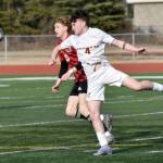 Kenai Centrals Zane James and Ketchikans Conor Pearson battle for the ball Wednesday, April 23, 2025, at Ed Hollier Field at Kenai Central High School in Kenai, Alaska. (Photo by Jeff Helminiak/Peninsula Clarion)