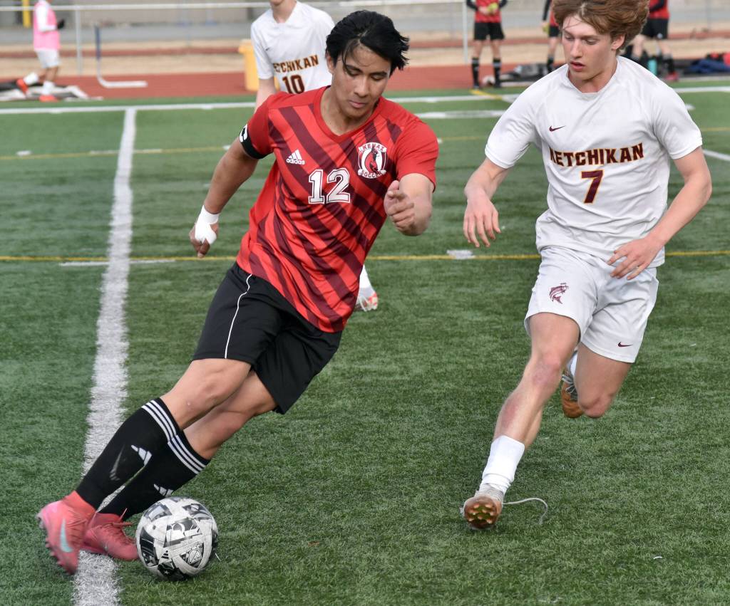 Kenai Centrals Enrique Mercade dribbles against Ketchikans Kingston Dell on Wednesday, April 23, 2025, at Ed Hollier Field at Kenai Central High School in Kenai, Alaska. (Photo by Jeff Helminiak/Peninsula Clarion)