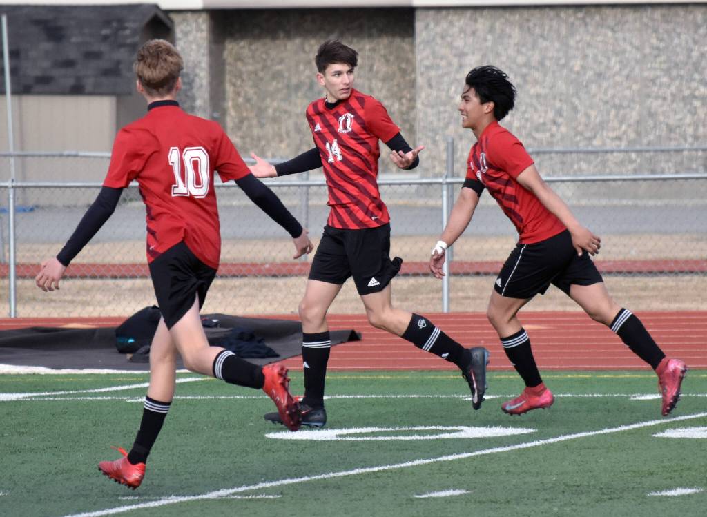 Kenai Centrals Miles Metteer (14) celebrates the game-winning goal against Ketchikan on Wednesday, April 23, 2025, at Ed Hollier Field at Kenai Central High School in Kenai, Alaska. (Photo by Jeff Helminiak/Peninsula Clarion)