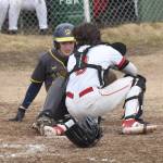 Homers Ben Engebretsen is tagged out by Kenai Central catcher Logan Mese on Friday, April 25, 2025, at the Kenai Little League fields in Kenai, Alaska. (Photo by Jeff Helminiak/Peninsula Clarion)