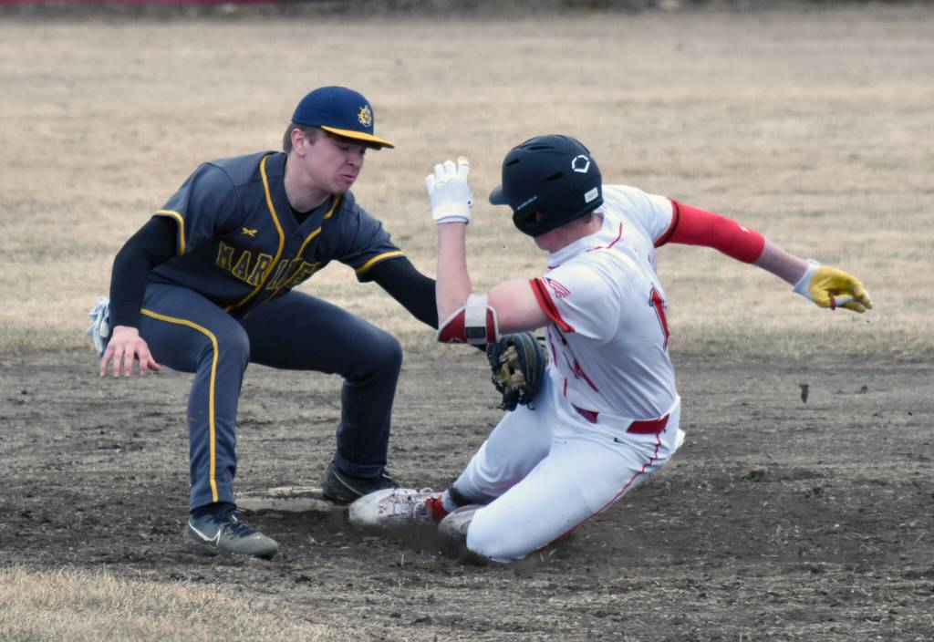 Homers Preston Stanislaw tags out Jacob Joanis at second base Friday, April 25, 2025, at the Kenai Little League fields in Kenai, Alaska. (Photo by Jeff Helminiak/Peninsula Clarion)