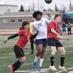 Kenai Centrals Enrique Mercado and Carter Felchle battle with Soldotnas Trae Pitsch for the ball Saturday, April 26, 2025, at Ed Hollier Field at Kenai Central High School in Kenai, Alaska. (Photo by Jeff Helminiak/Peninsula Clarion)