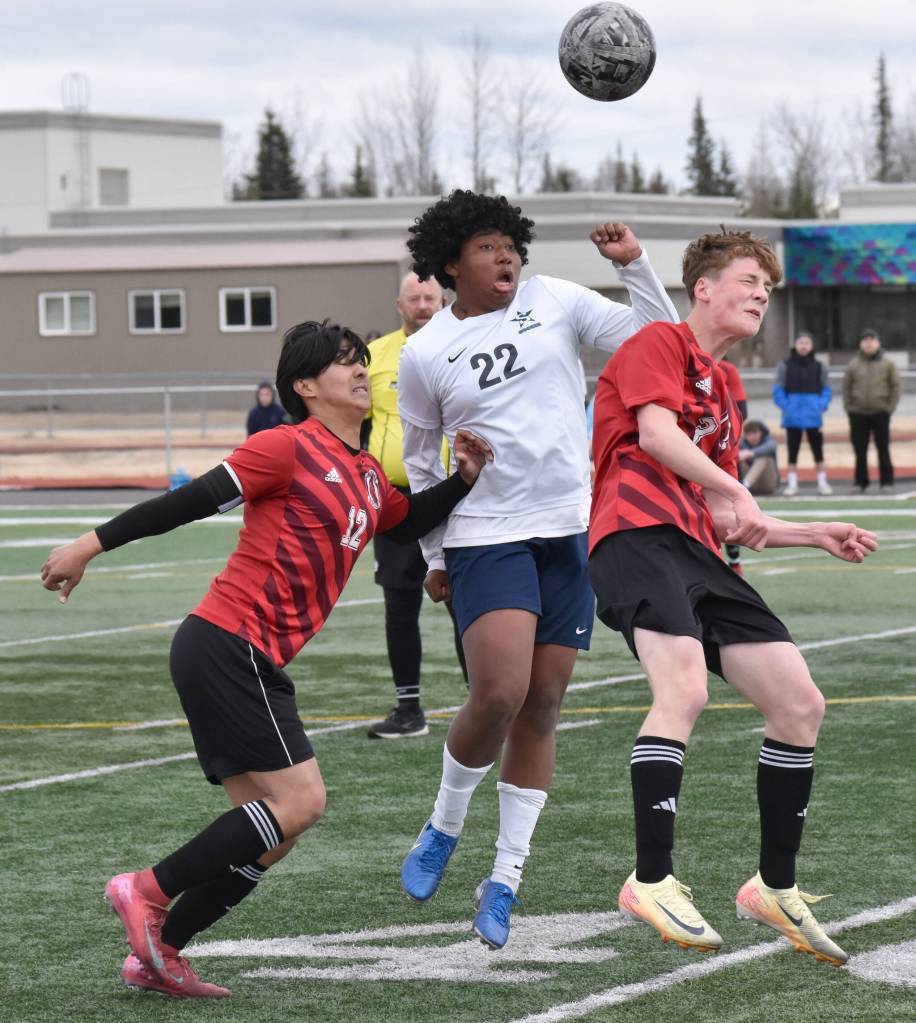 Kenai Centrals Enrique Mercado and Carter Felchle battle with Soldotnas Trae Pitsch for the ball Saturday, April 26, 2025, at Ed Hollier Field at Kenai Central High School in Kenai, Alaska. (Photo by Jeff Helminiak/Peninsula Clarion)