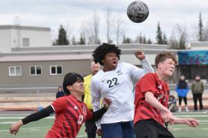 Kenai Central's Enrique Mercado and Carter Felchle battle with Soldotna's Trae Pitsch for the ball Saturday, April 26, 2025, at Ed Hollier Field at Kenai Central High School in Kenai, Alaska. (Photo by Jeff Helminiak/Peninsula Clarion)