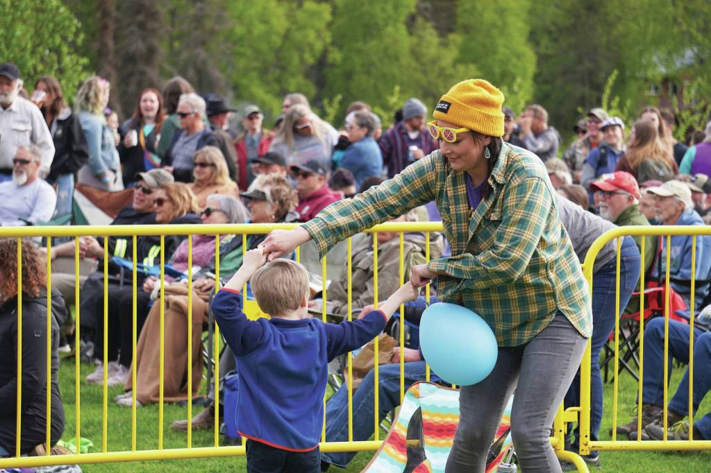 Attendees gather to dance and to listen during a performance by Blackwater Railroad Company, part of the Levitt AMP Soldotna Music Series on Wednesday, June 7, 2023, at Soldotna Creek Park. (Jake Dye/Peninsula Clarion)