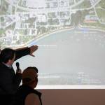 Project Manager Jerrod Stafford, of Western Marine Construction, points to a map of the Kenai River Bluff Stabilization Project while giving an update on the project in Kenai, Alaska, on Wednesday, April 30, 2025. (Jake Dye/Peninsula Clarion)