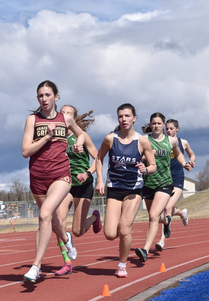 Soldotnas Annie Burns sits in the pack before winning the 800-meter run at the SoHi Invite on Saturday, May 3, 2025, at Soldotna High School in Soldotna, Alaska. (Photo by Jeff Helminiak/Peninsula Clarion)