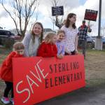 Students stand during a protest the possible closure of Sterling Elementary School along the Sterling Highway in Soldotna, Alaska, on Saturday, May 3, 2025. (Jake Dye/Peninsula Clarion)