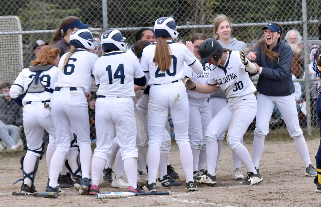 Juliet Innes (00) and Soldotna celebrate a home run by Innes against Homer on Monday, May 5, 2025, at the Soldotna Little League fields in Soldotna, Alaska. (Photo by Jeff Helminiak/Peninsula Clarion)