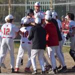 Kenai Centrals Daniel Steffensen (wearing batting helmet) and teammates celebrate Steffensens home run Friday, May 9, 2025, at the Kenai Little League fields in Kenai, Alaska. (Photo by Jeff Helminiak/Peninsula Clarion)