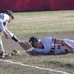 Homer third baseman Weston Marley tags out Kenai Centrals Jacob Joanis at third base Friday, May 9, 2025, at the Kenai Little League fields in Kenai, Alaska. (Photo by Jeff Helminiak/Peninsula Clarion)