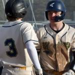 Homer's Weston Marley (3) and Preston Stanislaw celebrate a bases-clearing double against Kenai Central on Friday, May 9, 2025, at the Kenai Little League fields in Kenai, Alaska. (Photo by Jeff Helminiak/Peninsula Clarion)