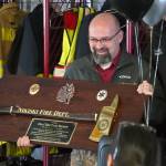 Retiring Nikiski Fire Department Chief Trent Burnett is honored at a retirement party at Nikiski Fire Station #1 in Nikiski, Alaska, on Wednesday, May 7, 2025. (Jake Dye/Peninsula Clarion)