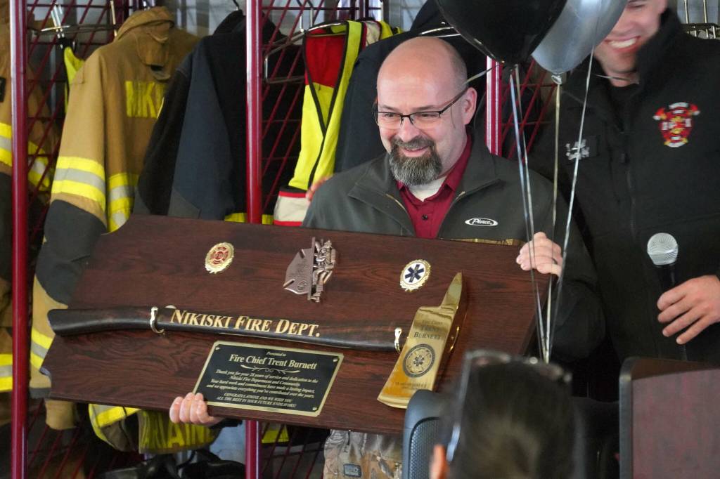 Retiring Nikiski Fire Department Chief Trent Burnett is honored at a retirement party at Nikiski Fire Station #1 in Nikiski, Alaska, on Wednesday, May 7, 2025. (Jake Dye/Peninsula Clarion)
