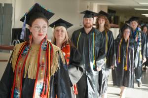 Graduates process into the 55th Annual Kenai Peninsula College Commencement Ceremony, held at Kenai Central High School in Kenai, Alaska, on Thursday, May 8, 2025. (Jake Dye/Peninsula Clarion)
