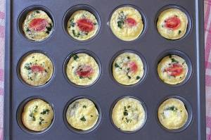 These high-protein egg bites are filled with tomatoes, parsley and feta, but any omelet-appropriate toppings will do. (Photo by Tressa Dale/Peninsula Clarion)
