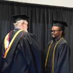 University of Alaska Anchorage graduate Winston Biodun Ajakaye receives his Bachelors in Business Administration degree at the 55th annual commencement ceremony on Wednesday, May 7, 2025, at Kachemak Bay Campus in Homer, Alaska. (Delcenia Cosman/Homer News)