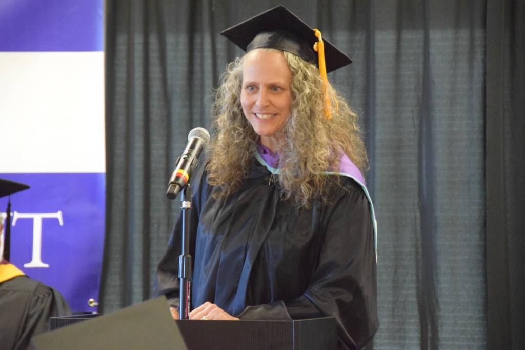 Michelle Waclawski, Alaska adult education coordinator for Kachemak Bay Campus, presents high school equivalency diplomas at the 55th annual commencement ceremony on Wednesday, May 7, 2025, at Kachemak Bay Campus in Homer, Alaska. (Delcenia Cosman/Homer News)
