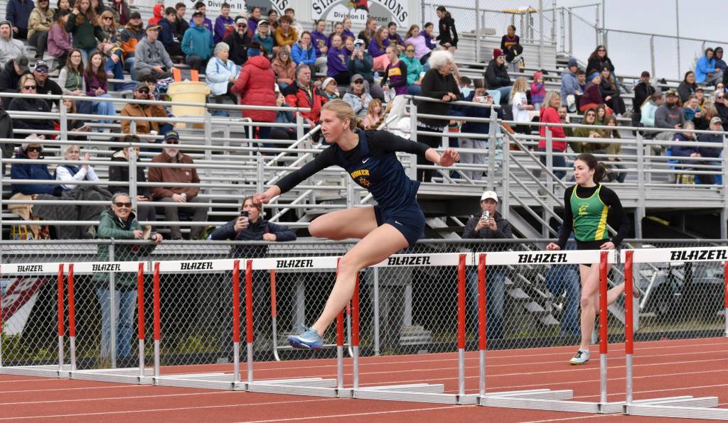 Homers Gracie Miotke wins the 100-meter hurdles Saturday, May 17, 2025, at the Kenai Peninsula Borough meet at Ed Hollier Field at Kenai Central High School in Kenai, Alaska. (Photo by Jeff Helminiak/Peninsula Clarion)