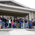 Jeff Dolifka and his children perform the ceremonial ribbon-cutting for the Boys and Girls Clubs of the Kenai Peninsulas Royce and Melba Roberts Campus in Kenai, Alaska, on Saturday, May 17, 2025. (Jake Dye/Peninsula Clarion)