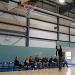 Mike Navarre shoots a dedicating basket during a ribbon-cutting event for the Boys and Girls Clubs of the Kenai Peninsulas Royce and Melba Roberts Campus in Kenai, Alaska, on Saturday, May 17, 2025. (Jake Dye/Peninsula Clarion)