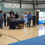 Clubhouse staff are recognized by Chief Executive Officer Shanette Wik during a ribbon-cutting event for the Boys and Girls Clubs of the Kenai Peninsulas Royce and Melba Roberts Campus in Kenai, Alaska, on Saturday, May 17, 2025. (Jake Dye/Peninsula Clarion)