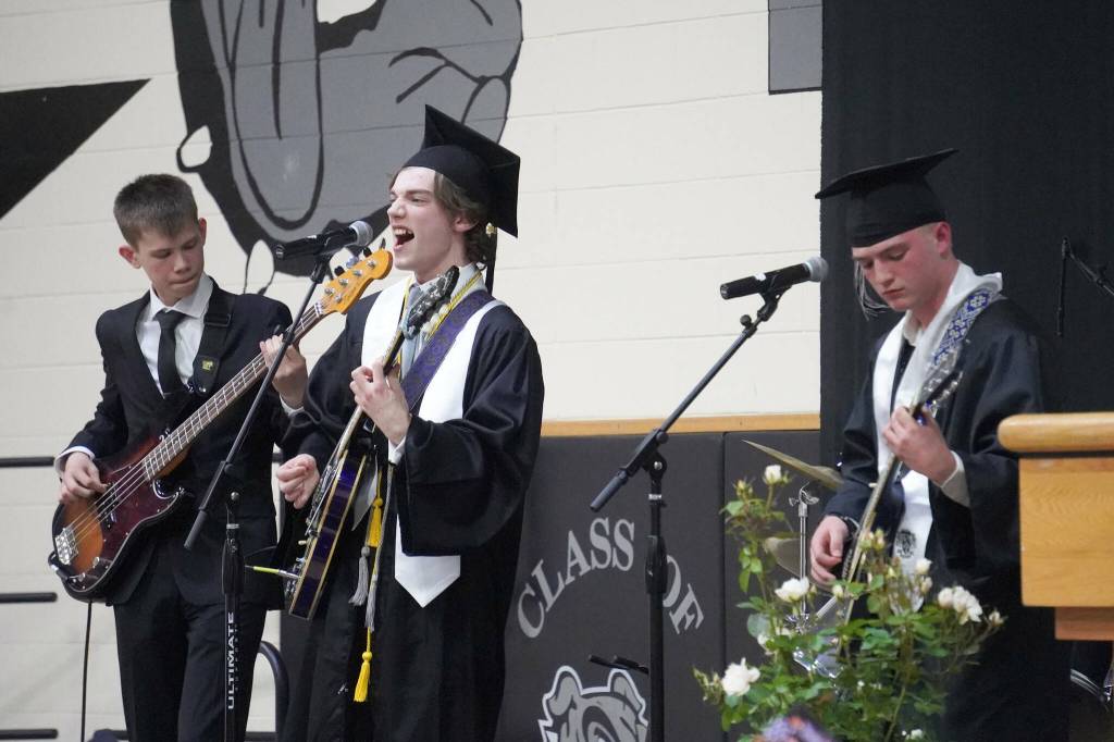 Kyler Allen, Kaleb Allen, Oliver Parrish and Kaden Parrish perform Life is a Highway during a commencement ceremony at Nikiski/Middle High School in Nikiski, Alaska, on Monday, May 19, 2025. (Jake Dye/Peninsula Clarion)