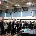 Nikiski graduates toss their caps at the end of a commencement ceremony at Nikiski/Middle High School in Nikiski, Alaska, on Monday, May 19, 2025. (Jake Dye/Peninsula Clarion)