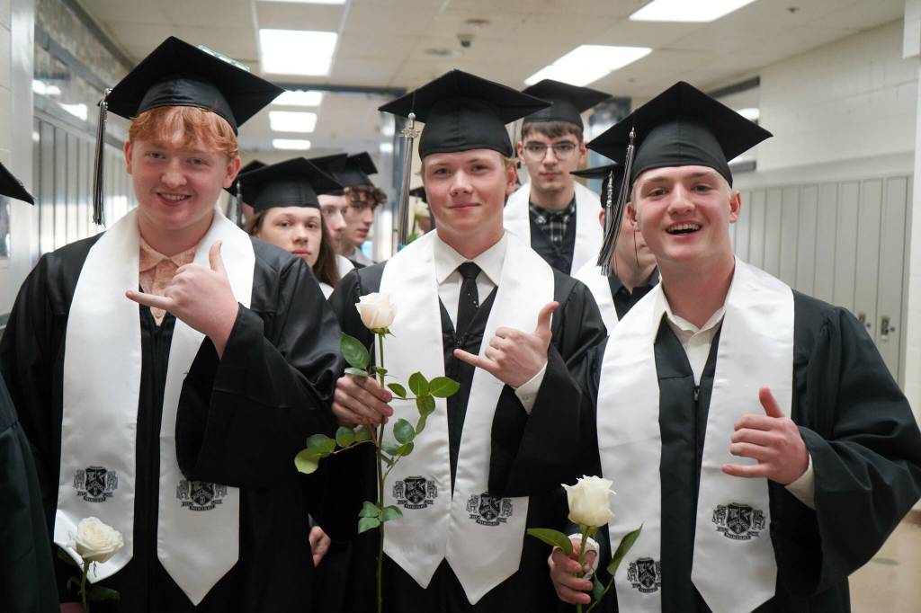 Nikiski graduates prepare to enter their graduation ceremony at Nikiski/Middle High School in Nikiski, Alaska, on Monday, May 19, 2025. (Jake Dye/Peninsula Clarion)