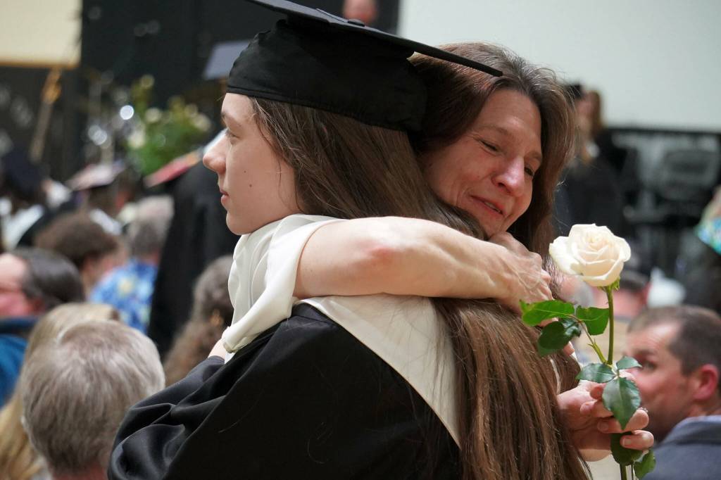 Nikiski graduates bring roses to their supporters during a commencement ceremony at Nikiski/Middle High School in Nikiski, Alaska, on Monday, May 19, 2025. (Jake Dye/Peninsula Clarion)