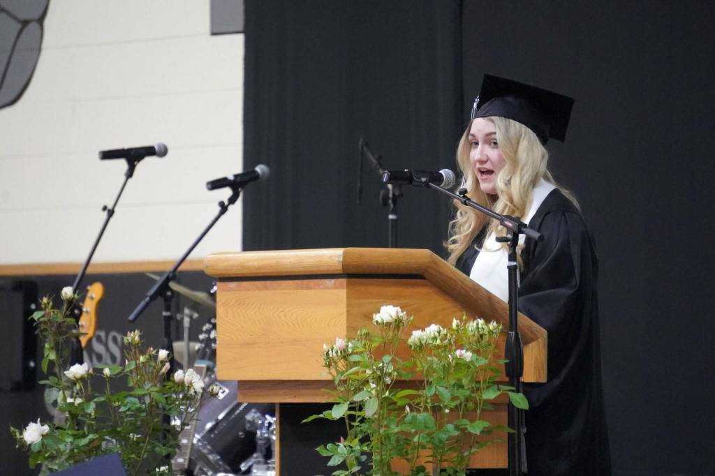 Nikiski graduate Belle Morris delivers an address during a commencement ceremony at Nikiski/Middle High School in Nikiski, Alaska, on Monday, May 19, 2025. (Jake Dye/Peninsula Clarion)
