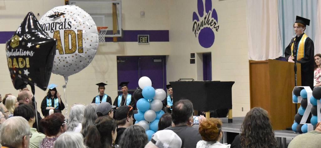 Gary McVey, co-valedictorian, delivers a speech at the River City Academy graduation ceremony Tuesday, May 20, 2025, at Skyview Middle School just outside of Soldotna, Alaska. (Photo by Jeff Helminiak/Peninsula Clarion)