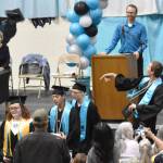 Nicholaus Benkendorf tosses his mortarboard at the River City Academy graduation ceremony Tuesday, May 20, 2025, at Skyview Middle School just outside of Soldotna, Alaska. (Photo by Jeff Helminiak/Peninsula Clarion)