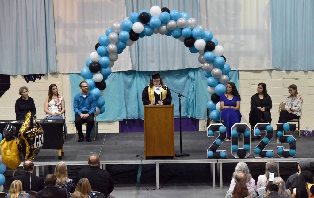 Ashlynn Parkin, co-valedictorian, delivers a speech at the River City Academy graduation ceremony Tuesday, May 20, 2025, at Skyview Middle School just outside of Soldotna, Alaska. (Photo by Jeff Helminiak/Peninsula Clarion)