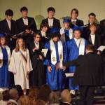 The Homer High School concert choir performs under the direction of Kyle Schneider during the 2025 Homer High School graduation ceremony on Wednesday, May 21, 2025, in the Alice Witte Gymnasium. (Chloe Pleznac/Homer News)