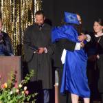 Graduating senior Rainey Sundheim hugs choral director Kyle Schneider as he presents her with her diploma during the 2025 Homer High School graduation ceremony on Wednesday, May 21, 2025, in the Alice Witte Gymnasium. (Chloe Pleznac/Homer News)
