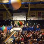 Seniors throw their graduation caps in jubilant celebration while attendees fling beach balls in the air from the bleachers during the 2025 Homer High School graduation ceremony on Wednesday, May 21, 2025, in the Alice Witte Gymnasium. (Chloe Pleznac/Homer News)