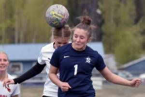 Soldotna's Mia Hannevold heads in a goal on a corner kick Thursday, May 22, 2025, at Justin Maile Field at Soldotna HIgh School in Soldotna, Alaska. (Photo by Jeff Helminiak/Peninsula Clarion)