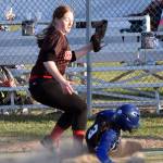 Palmers Lizzy McQuillin slides into home safely as the ball pops out of the glove of Kenai Centrals Avery Ellis on Friday, May 23, 2025, at Steve Shearer Memorial Ball Park in Kenai, Alaska. (Photo by Jeff Helminiak/Peninsula Clarion)