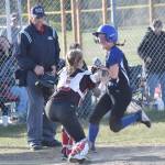 Palmers Jane Meals is tagged out by Kenai Central catcher Avia Miller during the first game of a doubleheader Friday, May 23, 2025, at Steve Shearer Memorial Ball Park in Kenai, Alaska. (Photo by Jeff Helminiak/Peninsula Clarion)